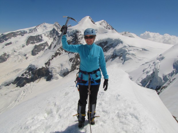 Catherine on top of Pollux with Monte Rosa in the background